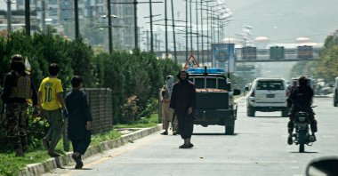 Taliban fighters (C) stand guard along a road near the Russian Embassy after a suicide attack in Kabul, Afghanistan, Sept. 5, 2022. (AFP Photo)