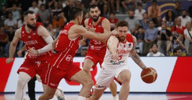 Turkey's Onuralp Bitim (R) in action against Georgia at the FIBA 2022 EuroBasket, Tbilisi, Georgia, Sept. 4, 2022. (AA Photo)