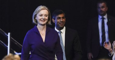 Liz Truss (L) and Rishi Sunak (C) arrive for the announcement of the result of the Conservative Party leadership contest at the Queen Elizabeth II center in London, U.K., Sept. 5, 2022. (AP Photo)