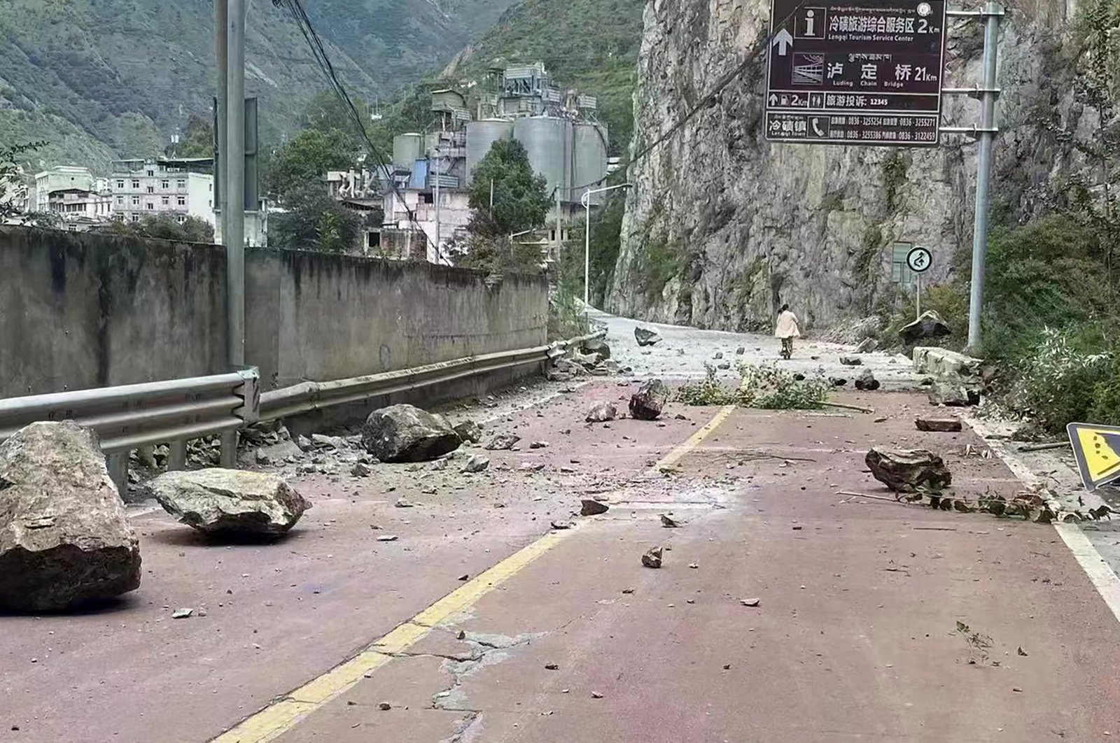 Fallen rocks are seen on a road near Lengqi Town in Luding County, Sichuan Province, China, Sept. 5, 2022. (Xinhua via AP)