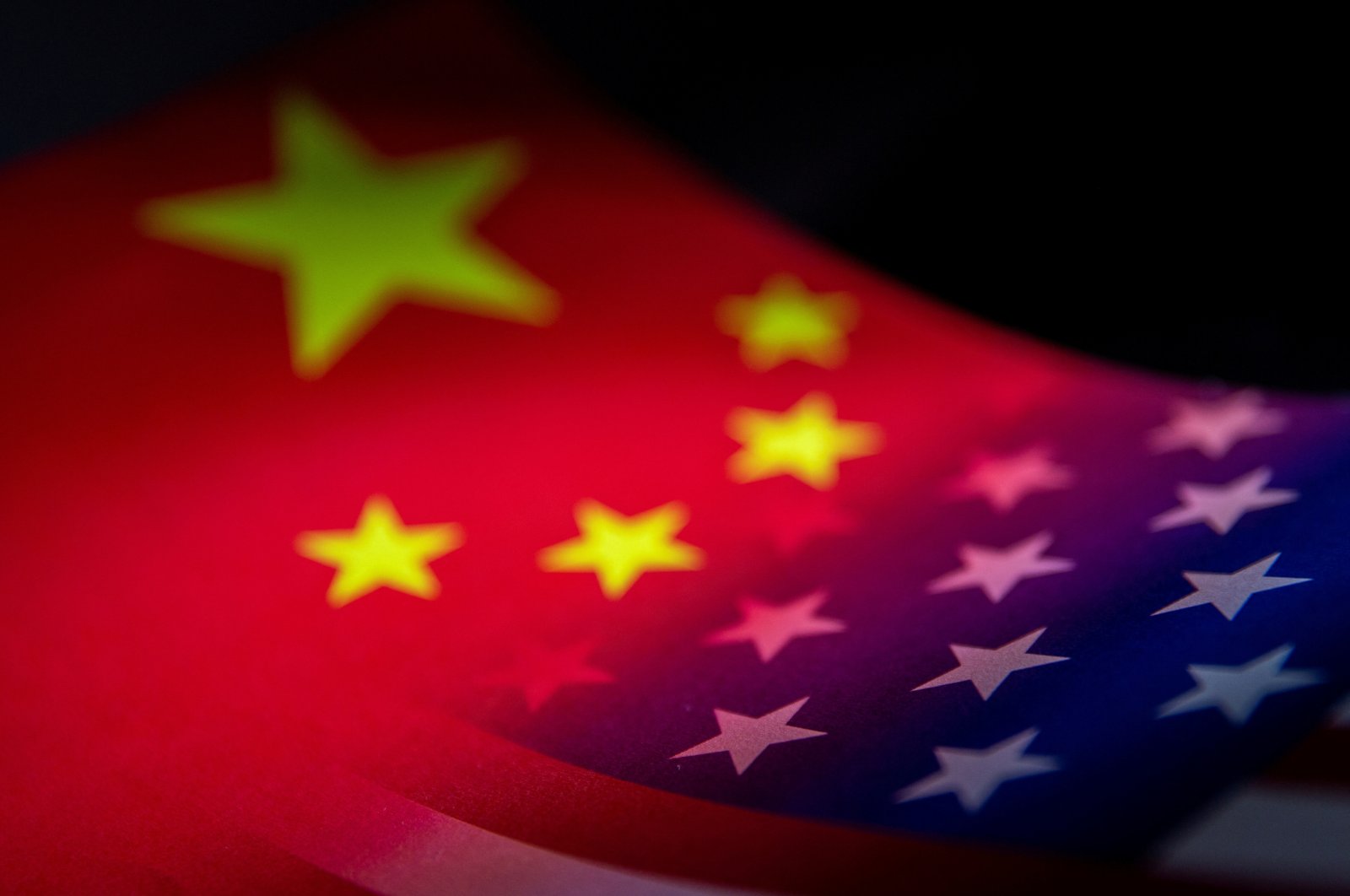 The flags of China and the United States are seen printed on paper in this illustration taken on Jan. 27, 2022. (Reuters Photo)
