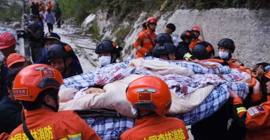 Rescue workers carry an injured person after a 6.6 magnitude earthquake in Luding county, Ganzi, Sichuan province, China, Sept. 5, 2022. (AFP Photo)