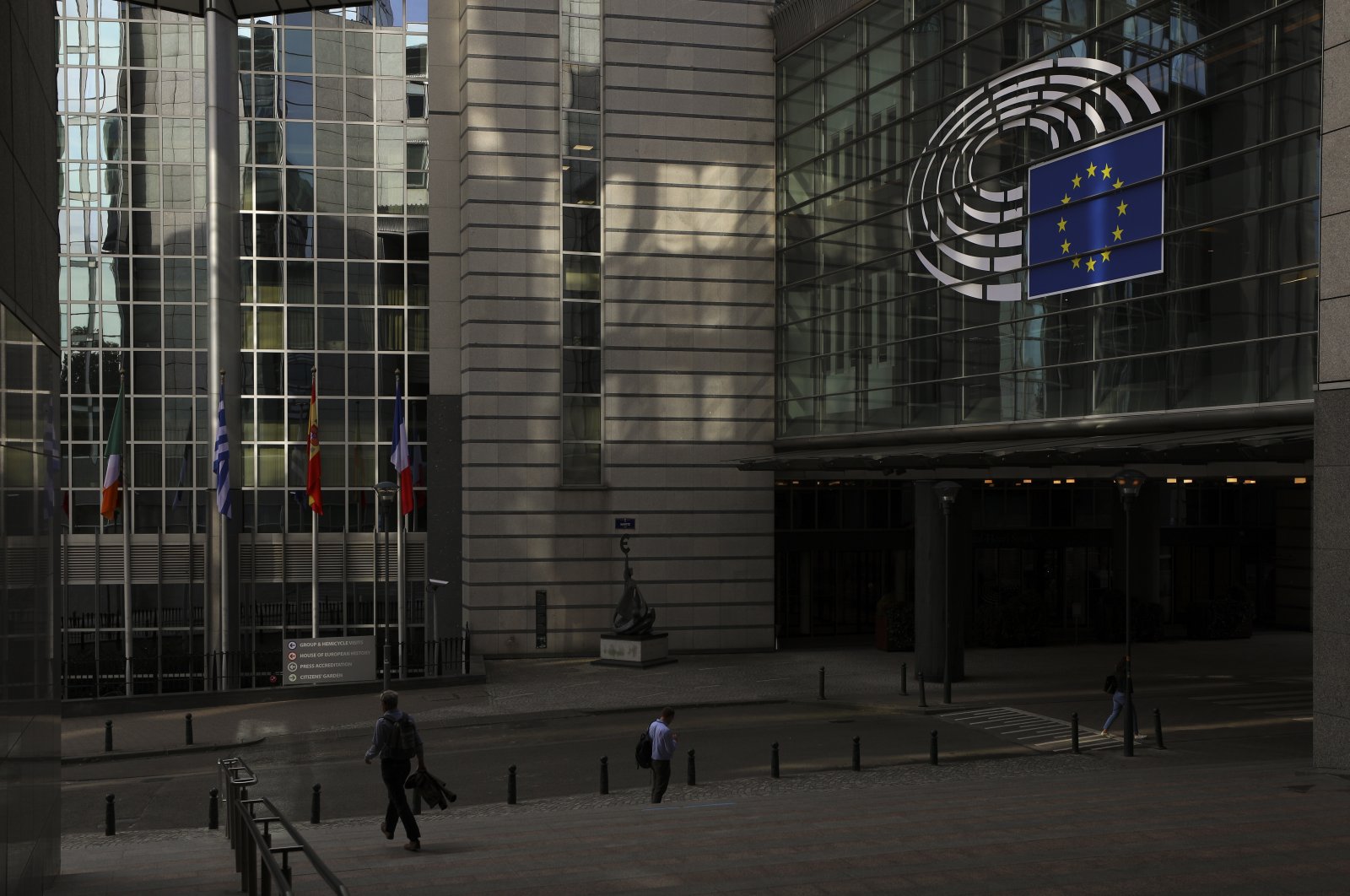 People walk past the European Parliament in Brussels, Belgium, July 6, 2022. (Reuters Photo)