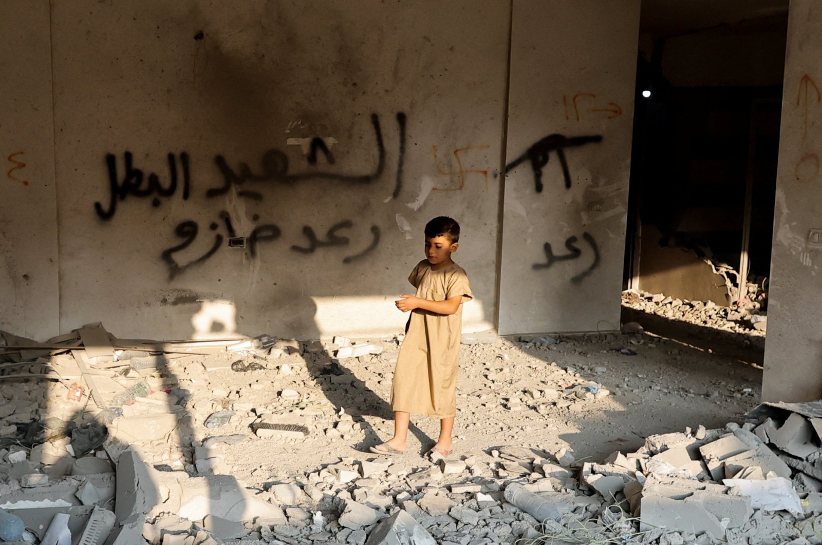 A Palestinian boy walks in the house of Raed Hazem after it was demolished by Israeli forces in Jenin, in the Israeli-occupied West Bank, Palestine, Sept. 6, 2022. (Reuters Photo)