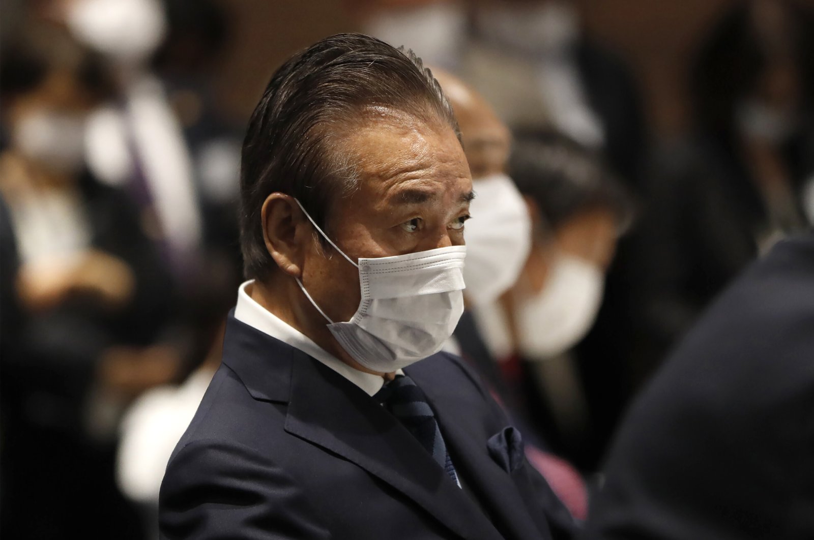 Haruyuki Takahashi, executive board member of the Tokyo Olympics Organizing Committee, attends a meeting, Tokyo, Japan, March 30, 2020. (AP Photo)