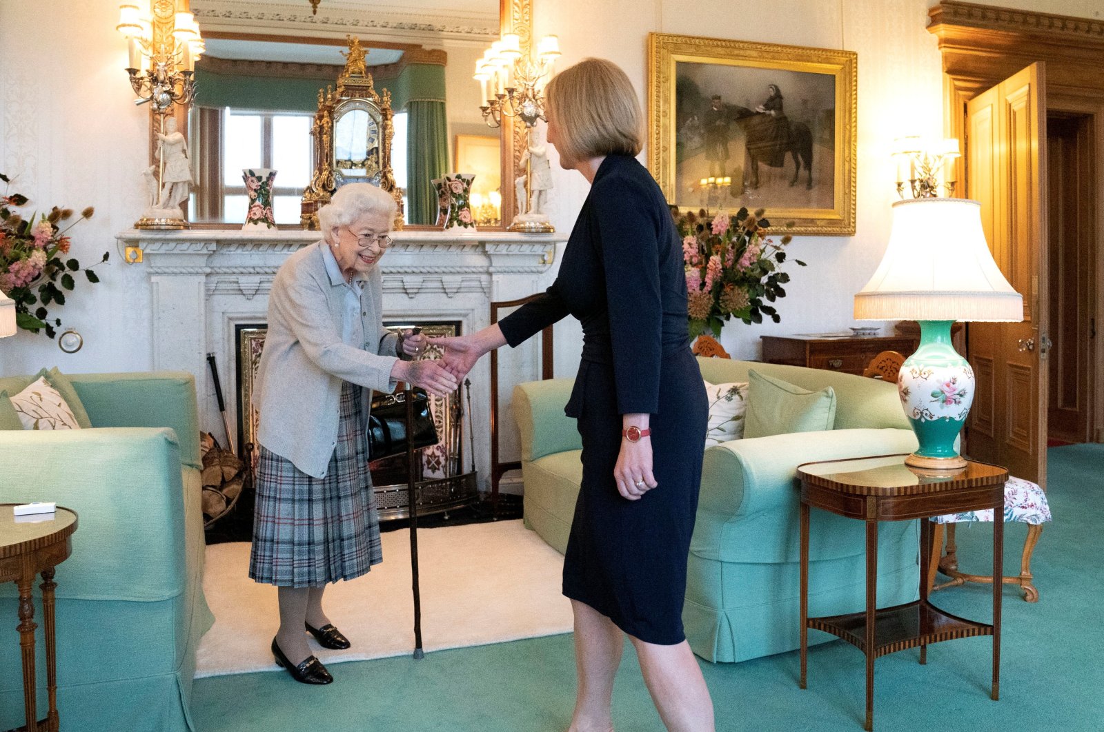 Queen Elizabeth (L) welcomes Liz Truss during an audience where she invited the newly elected leader of the Conservative party to become prime minister and form a new government, at Balmoral Castle, Scotland, U.K, Sept. 6, 2022. (Reuters Photo)