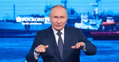 Russian President Vladimir Putin gestures as he delivers a speech during a plenary session at the Eastern Economic Forum in Vladivostok, Russia, Sept. 7, 2022. (Tass via AP)