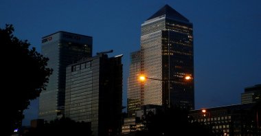 Office lights are on in banks as dawn breaks behind the financial district of Canary Wharf, in London, Britain, June 24, 2016. (Reuters Photo)