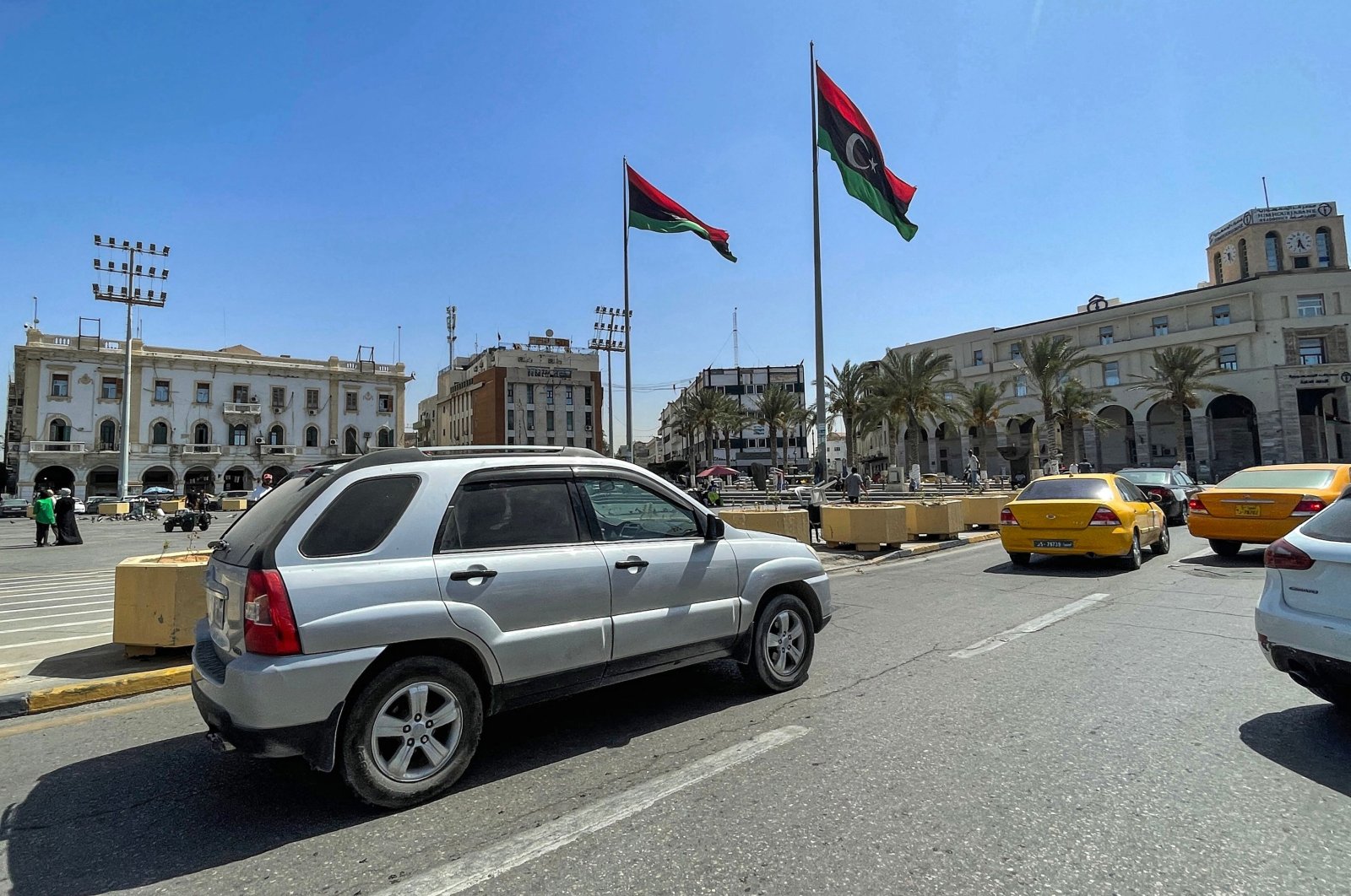 Vehicles drive along the Martyrs&#039; Square in the center of Libya&#039;s capital Tripoli on Aug. 29, 2022. (AFP Photo)