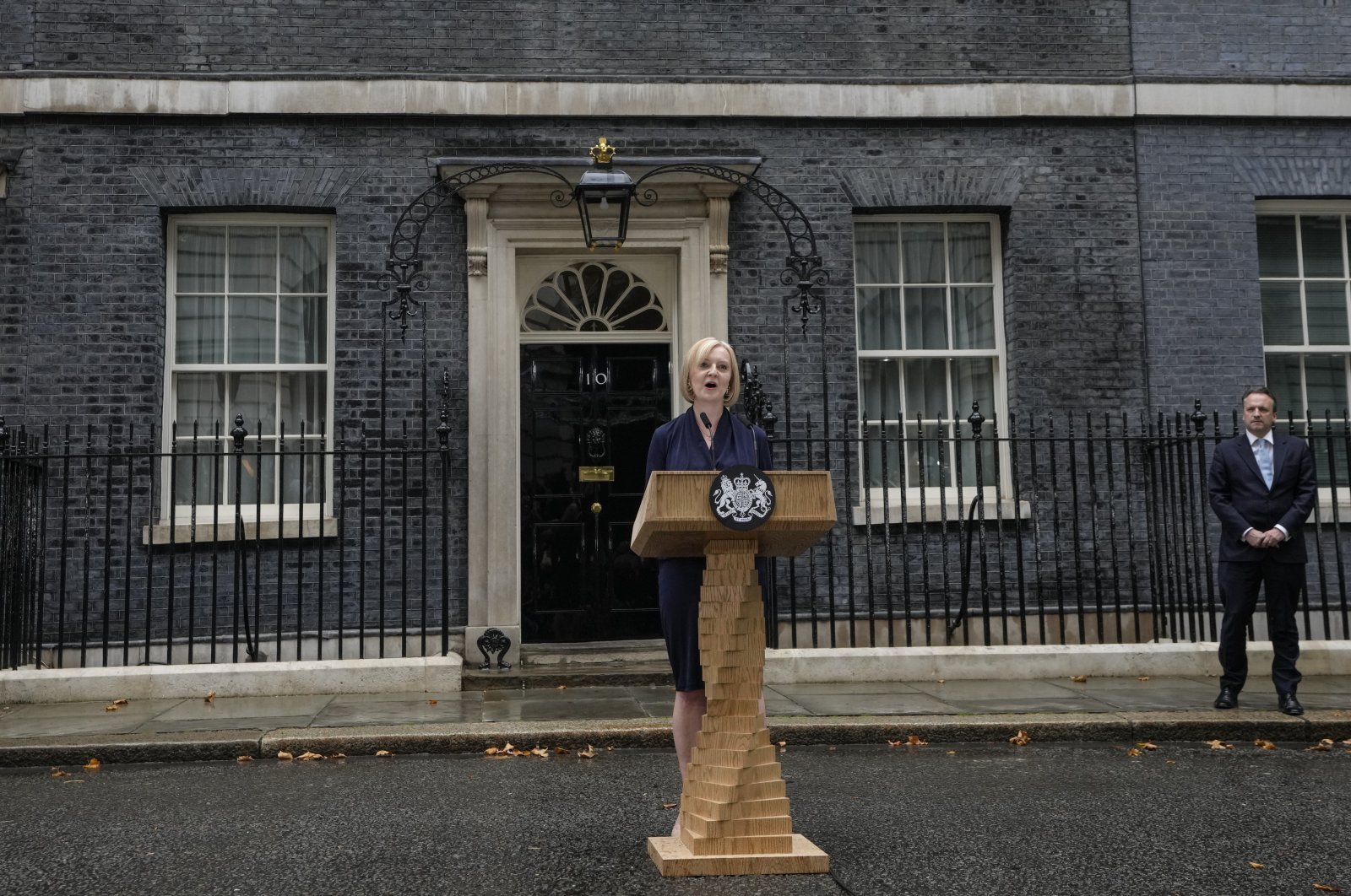 New British Prime Minister Liz Truss makes an address outside Downing Street as her husband Hugh O&#039;Leary listens, in London, Sept. 6, 2022. (AP Photo)