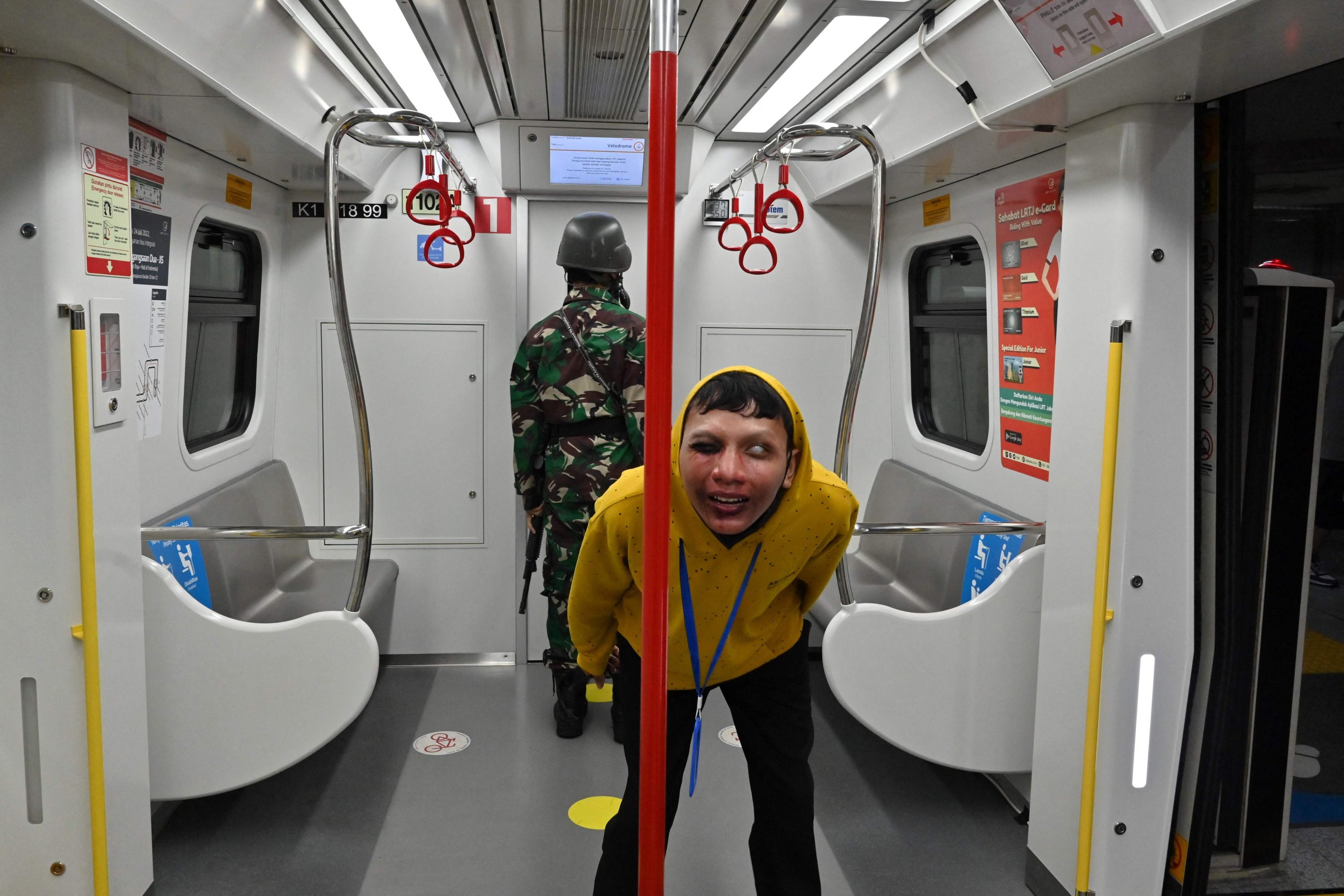 This picture shows performers acting out as zombies attacking a soldier on board an LRT coach as part of the 