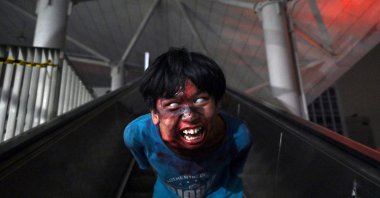 This picture shows man acting as a zombie at an LRT station as part of the "Train to Apocalypse" event, part of an initiative to attract commuters to ride the city's rapid transit system, Jakarta, Indonesia, Sept. 4, 2022. (AFP Photo)