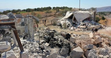 This picture shows damaged buildings following a reported pro-regime forces bombing, in the Syrian opposition-held western countryside of Idlib, Sept. 8, 2022. (AFP Photo)