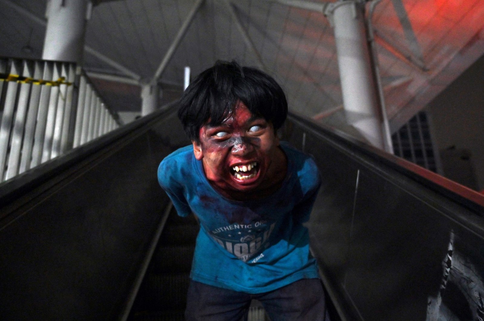 This picture shows man acting as a zombie at an LRT station as part of the &quot;Train to Apocalypse&quot; event, part of an initiative to attract commuters to ride the city&#039;s rapid transit system, Jakarta, Indonesia, Sept. 4, 2022. (AFP Photo)