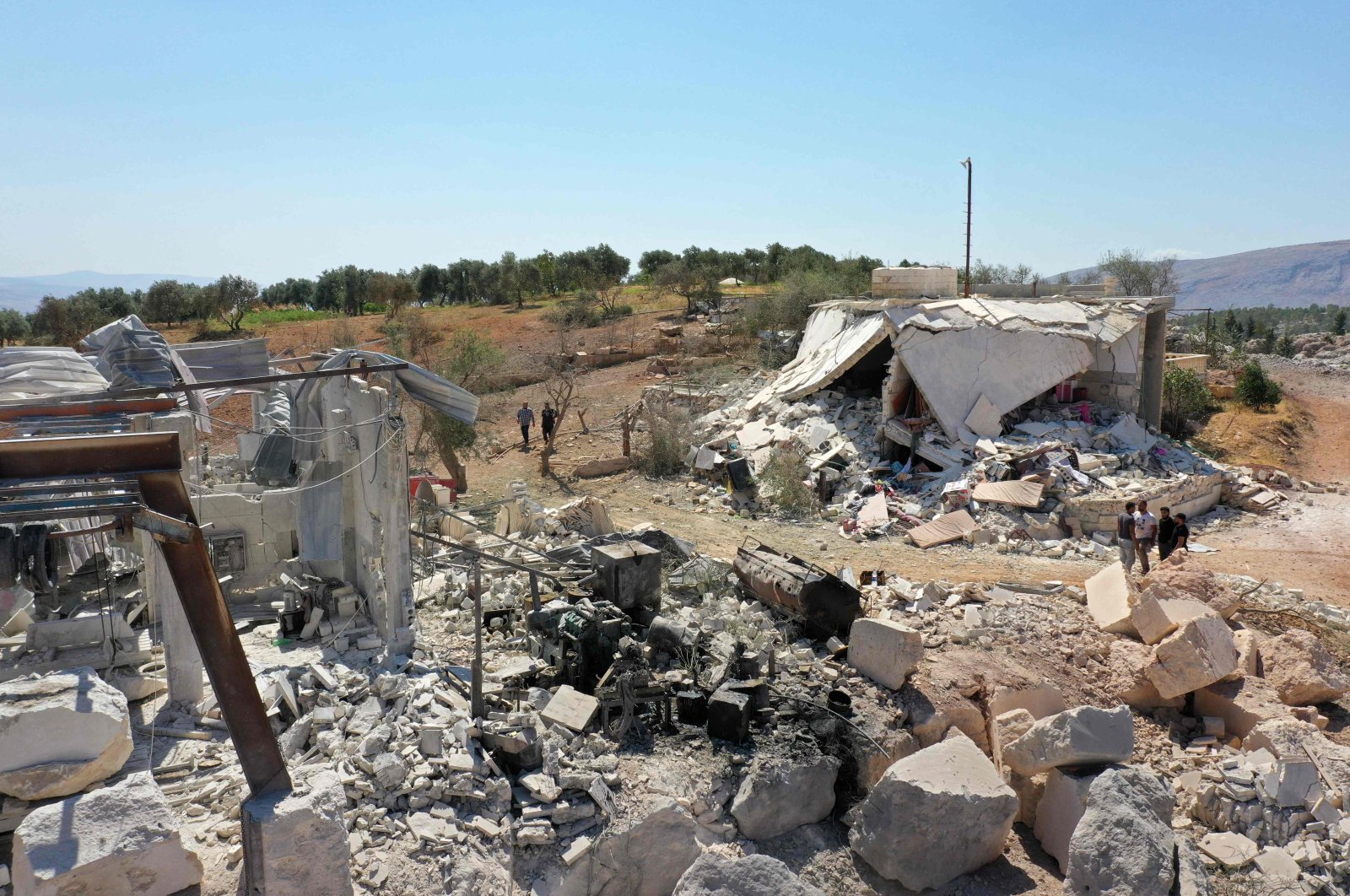 This picture shows damaged buildings following a reported pro-regime forces bombing, in the Syrian opposition-held western countryside of Idlib, Sept. 8, 2022. (AFP Photo)