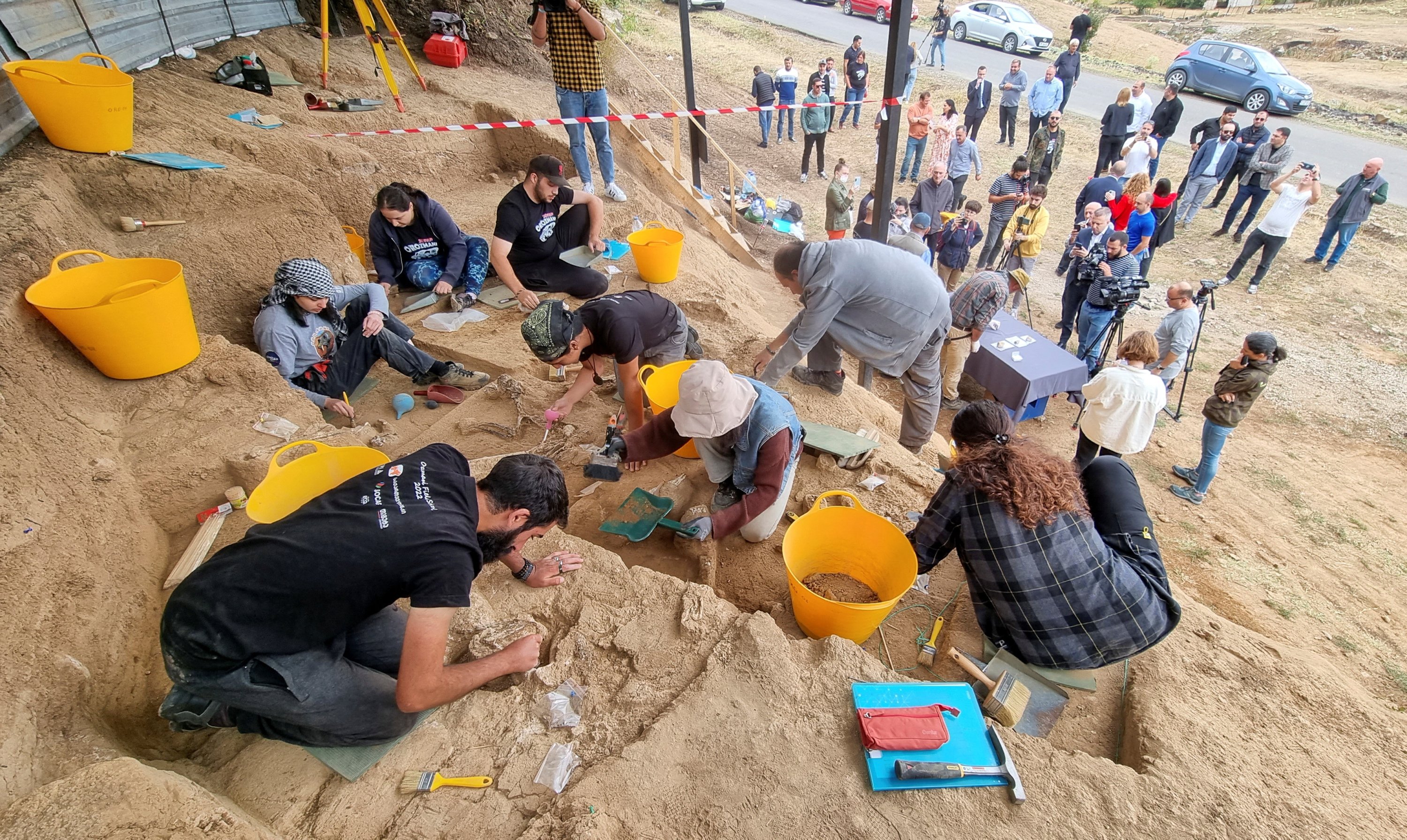 Archaeologists work at a dig site following the discovery of a tooth belonging to an early species of human, which was recovered from rock layers presumably dated to 1.8 million years old, near an excavation site in Dmanisi outside the village of Orozmani, Georgia, Sept. 8, 2022. (Reuters Photo)