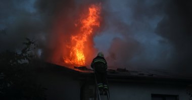 Ukrainian firefighters put out a fire in a residential house after a Russian military strike, as Russia's attack on Ukraine continues, in Kharkiv, Ukraine, Sept. 10, 2022. (Reuters Photo)