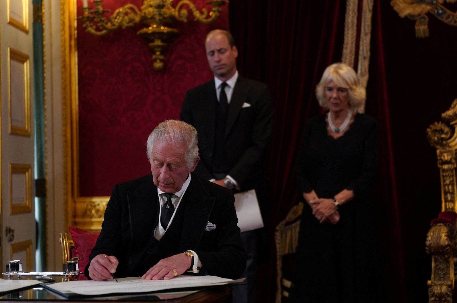 Britain&#039;s King Charles signs an oath during the Accession Council at St. James&#039;s Palace, where he was formally proclaimed Britain&#039;s new monarch, following the death of Queen Elizabeth II, in London, Britain, Sept. 10, 2022. (Reuters Photo)