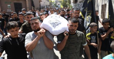 Palestinians carry the body of Hamad Mustafa Hussein Abu Jelda at Jenin refugee camp, West Bank, Palestine, Sept. 11, 2022. (EPA Photo)