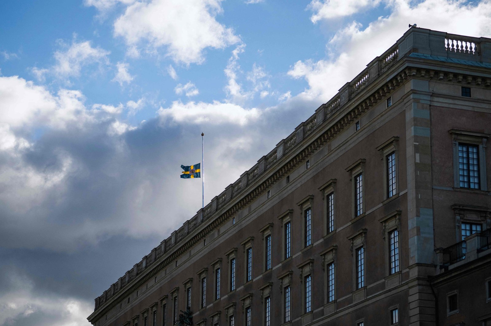 The Swedish flag flies at half-mast atop the Royal Palace in Stockholm, Sweden, Sept. 9, 2022. (AFP Photo)