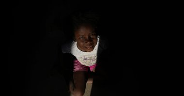 A child plays in her home of the Kalunga quilombo, in the rural area of Cavalcante in Goias state, Brazil, Aug. 15, 2022. The villager´s ancestors settled there as runaway slaves. (AP Photo)