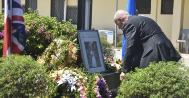 New Zealand High Commissioner to the Solomon Islands, Jonathon Schwass lays a wreath at Government House in Honiara, Solomon Island, during a ceremony to mark the passing of Queen Elizabeth II, Sept. 12, 2022. (AP Photo/Charley Piringi)
