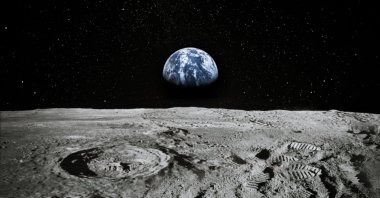 View of Moon limb with Earth rising on the horizon. (Shutterstock Photo)