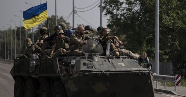 Ukrainian soldiers ride atop an armored vehicle on a road in Donetsk region, eastern Ukraine, Aug. 28, 2022. (AP File Photo)