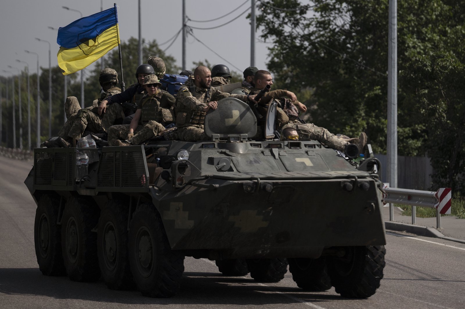 Ukrainian soldiers ride atop an armored vehicle on a road in Donetsk region, eastern Ukraine, Aug. 28, 2022. (AP File Photo)