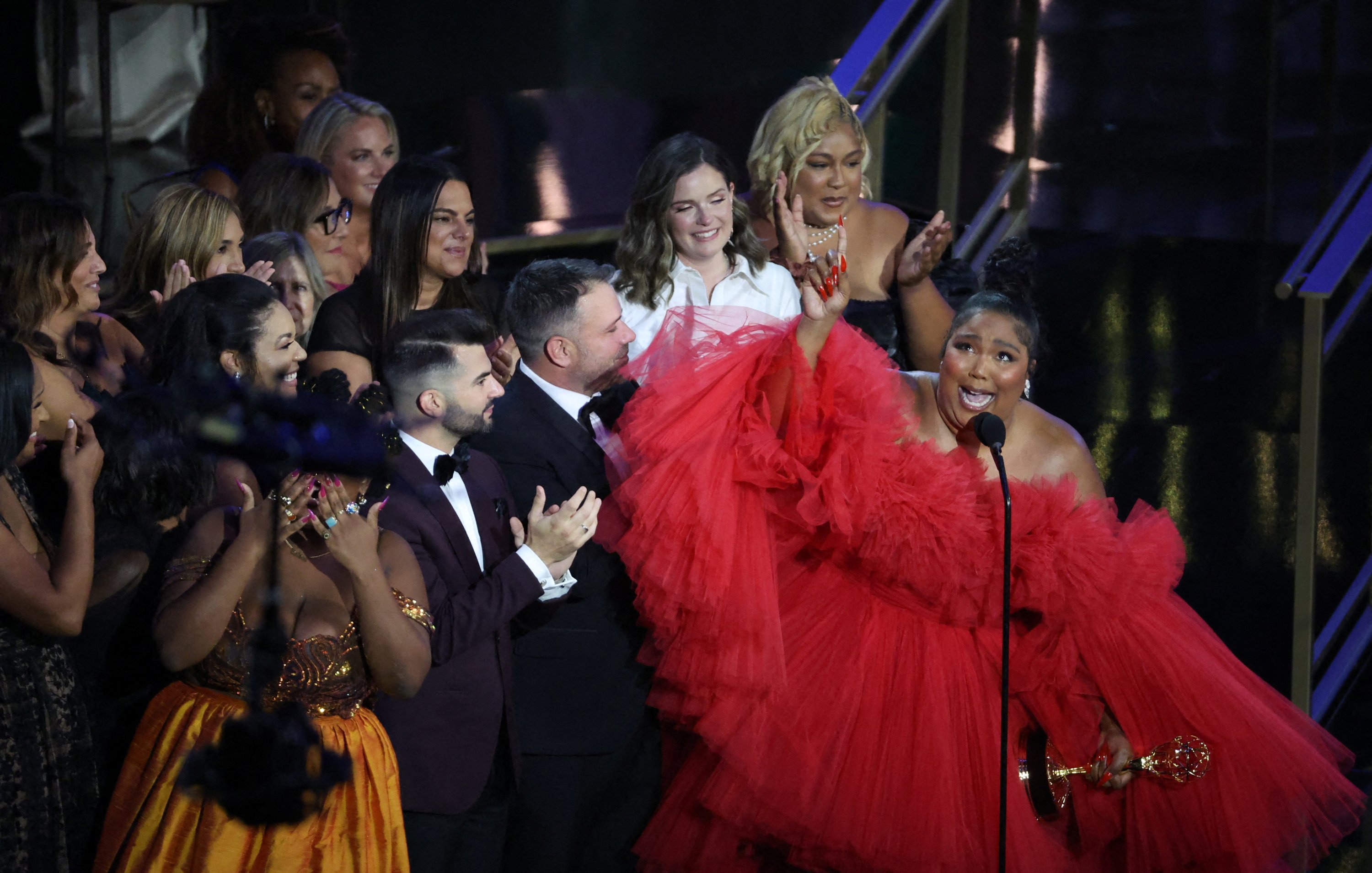 Lizzo and other cast members celebrate as she accepts the award for Outstanding Competition Program for 