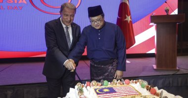 Turkish Defense Minister Hulusi Akar (L) attends the reception hosted by Malaysian Ambassador Sazali Bin Mustafa Kamal (R) to mark the 65th anniversary of Malaysia&#039;s independence in Ankara, Türkiye, Sept. 12, 2022. (AA Photo)