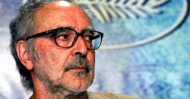 Swiss director Jean-Luc Godard listens to questions during a press conference for his film entry "Notre Musique," which was screened out of competition at the 57th Cannes Film Festival, May 18, 2004. (Reuters Photo)