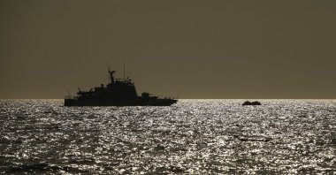 A Turkish coast guard vessel approaches a life raft with migrants in the Aegean Sea, between Türkiye and Greece, Sept. 12, 2020. (AP File Photo)