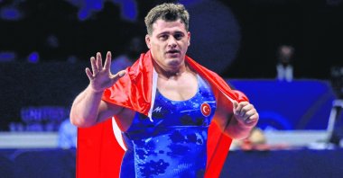 Rıza Kayaalp celebrates winning gold at the World Wrestling Championships, Belgrade, Serbia, Sept. 14, 2022. (AA Photo)