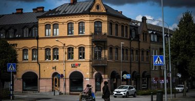 Two women cross a street in Sjobo, Skane County, Sweden, Sept. 12, 2022. (AFP Photo)
