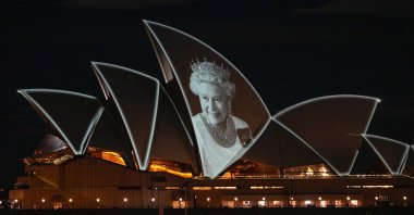 The Sydney Opera House is illuminated with a portrait of Queen Elizabeth II in Sydney, Australia, Sept. 9, 2022. (AP Photo)