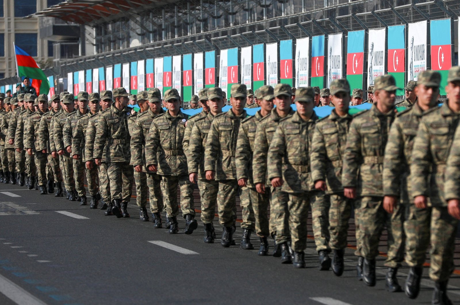 Azerbaijani service members take part in a procession marking the anniversary of the end of the 2020 military conflict over the Nagorno-Karabakh region, in Baku, Azerbaijan, Nov. 8, 2021. (Reuters Photo)