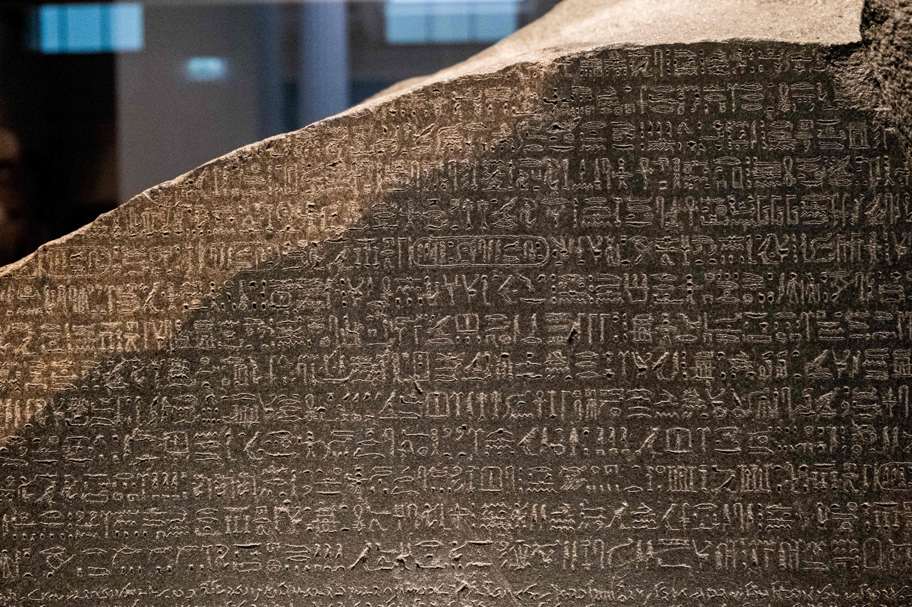 A view of the top portion of the Rosetta Stone showing the ancient Egyptian hieroglyphic text, on display at the British Museum in London, U.K., July 26, 2022. (AFP Photo)