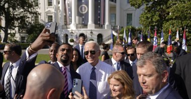 U.S. President Joe Biden poses for a photo after speaking on the South Lawn of the White House, in Washington, U.S., Sept. 13, 2022. (AP Photo)