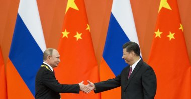 Chinese President Xi Jinping (R) and Russian President Vladimir Putin shake hands during an award ceremony at the Great Hall of the People in Beijing, China, June 8, 2018. (AP Photo)