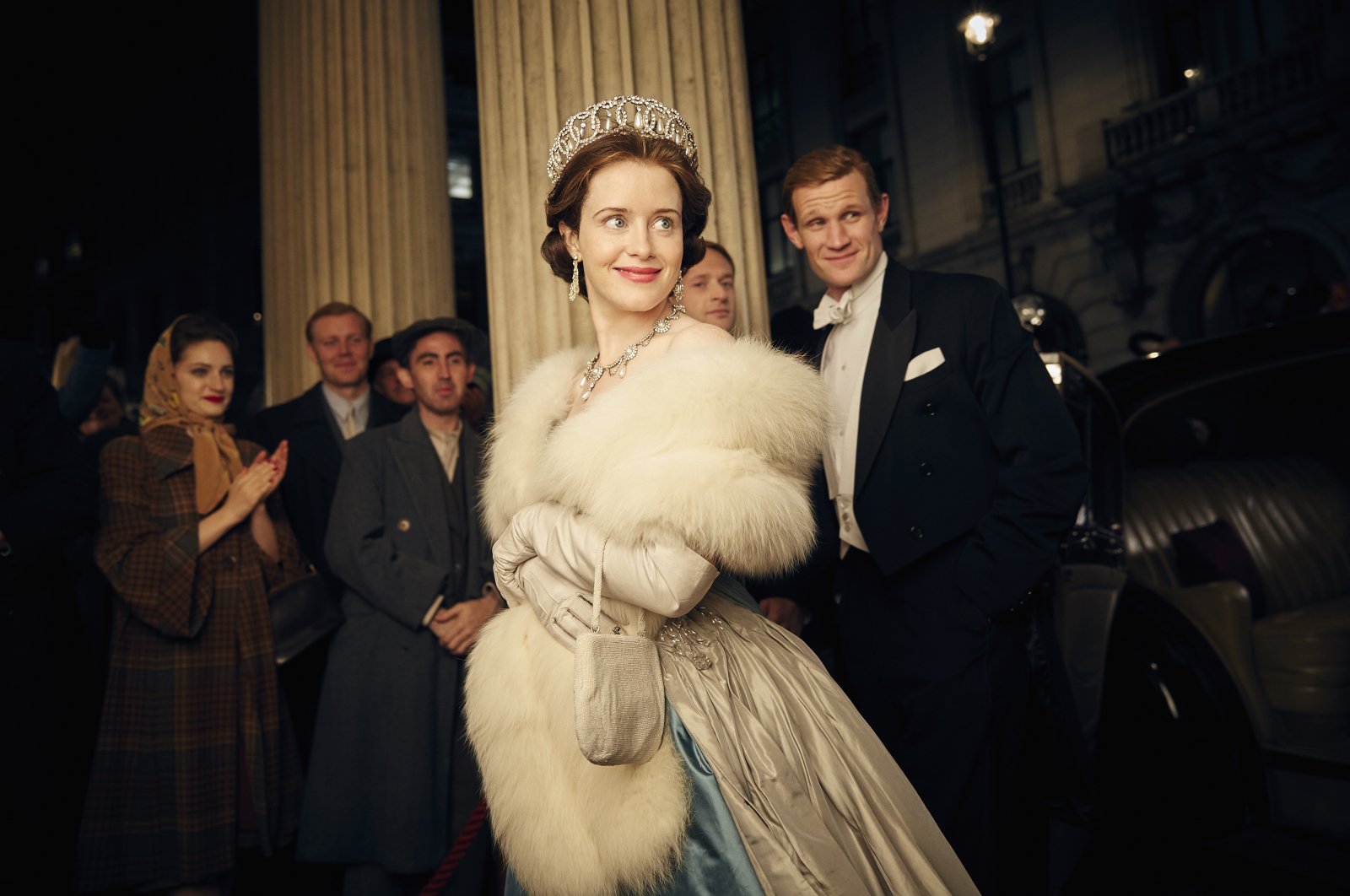 This image released by Netflix shows Claire Foy (C) and Matt Smith (R), in a scene from &quot;The Crown.&quot; (AP Photo)