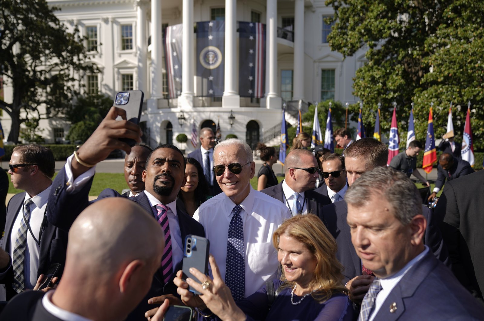 U.S. President Joe Biden poses for a photo after speaking on the South Lawn of the White House, in Washington, U.S., Sept. 13, 2022. (AP Photo)