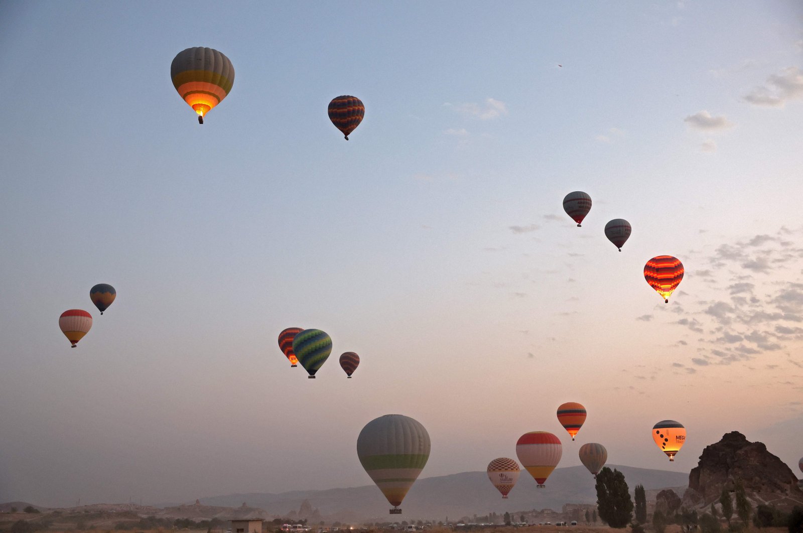 Sight-seeing hot air balloons launch in Göreme Historical National Park in the Cappadocia region, Nevşehir, central Türkiye, Aug. 24, 2022. (AFP Photo)