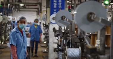 Workers produce deoxidizing agents at a factory in Nanjing in Jiangsu province, eastern China, Sept.16, 2022. (AFP Photo)