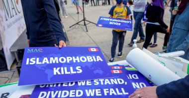 Attendees return signs after a rally to highlight Islamophobia, in Toronto, Ontario, Canada, June 18, 2021. (Reuters Photo)