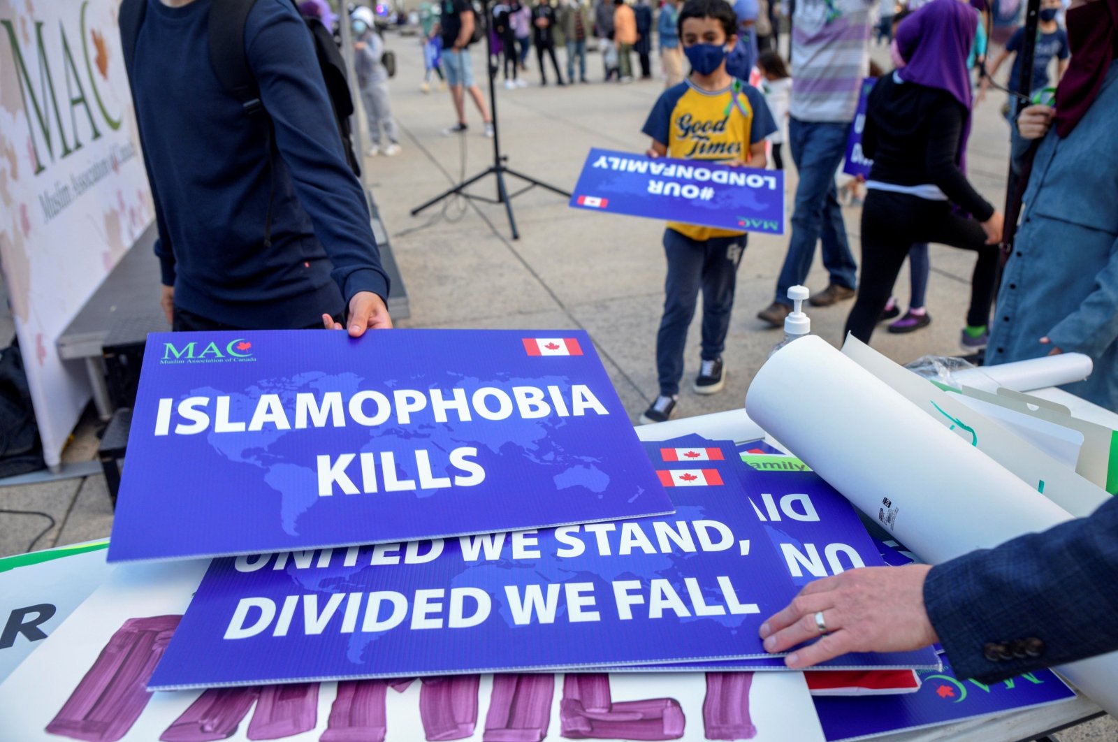 Attendees return signs after a rally to highlight Islamophobia, in Toronto, Ontario, Canada, June 18, 2021. (Reuters Photo)