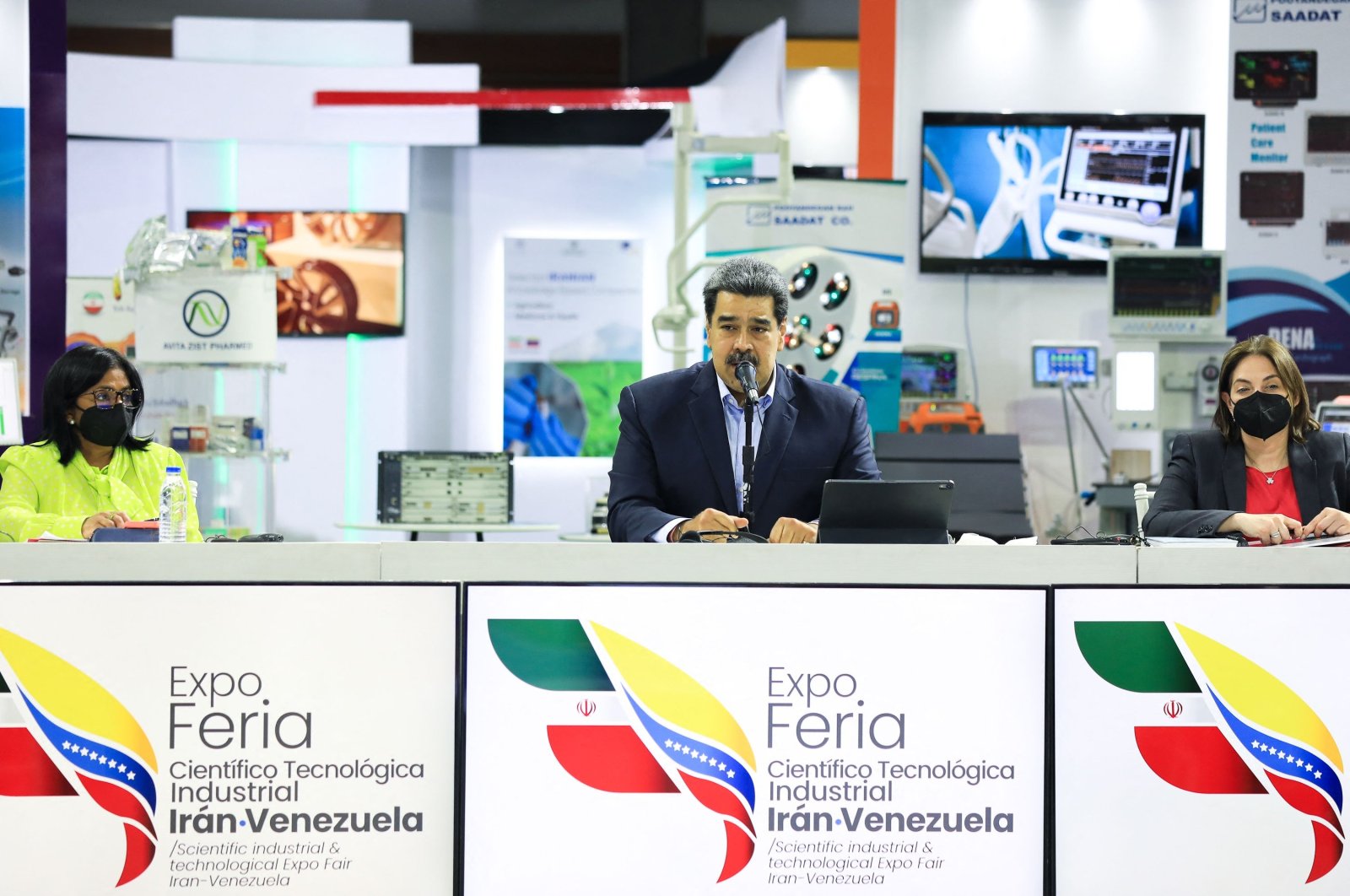 Venezuela&#039;s President Nicolas Maduro (C) speaking next to Vice-President Delcy Rodriguez (L) and Minister of Science and Technology Gabriela Jimenez during the opening ceremony of the Iran-Venezuela Industrial Scientific and Technological Expoferia, at the Poliedro stadium in Caracas, Sept. 15, 2022. (Venezuelan Presidency / AFP)