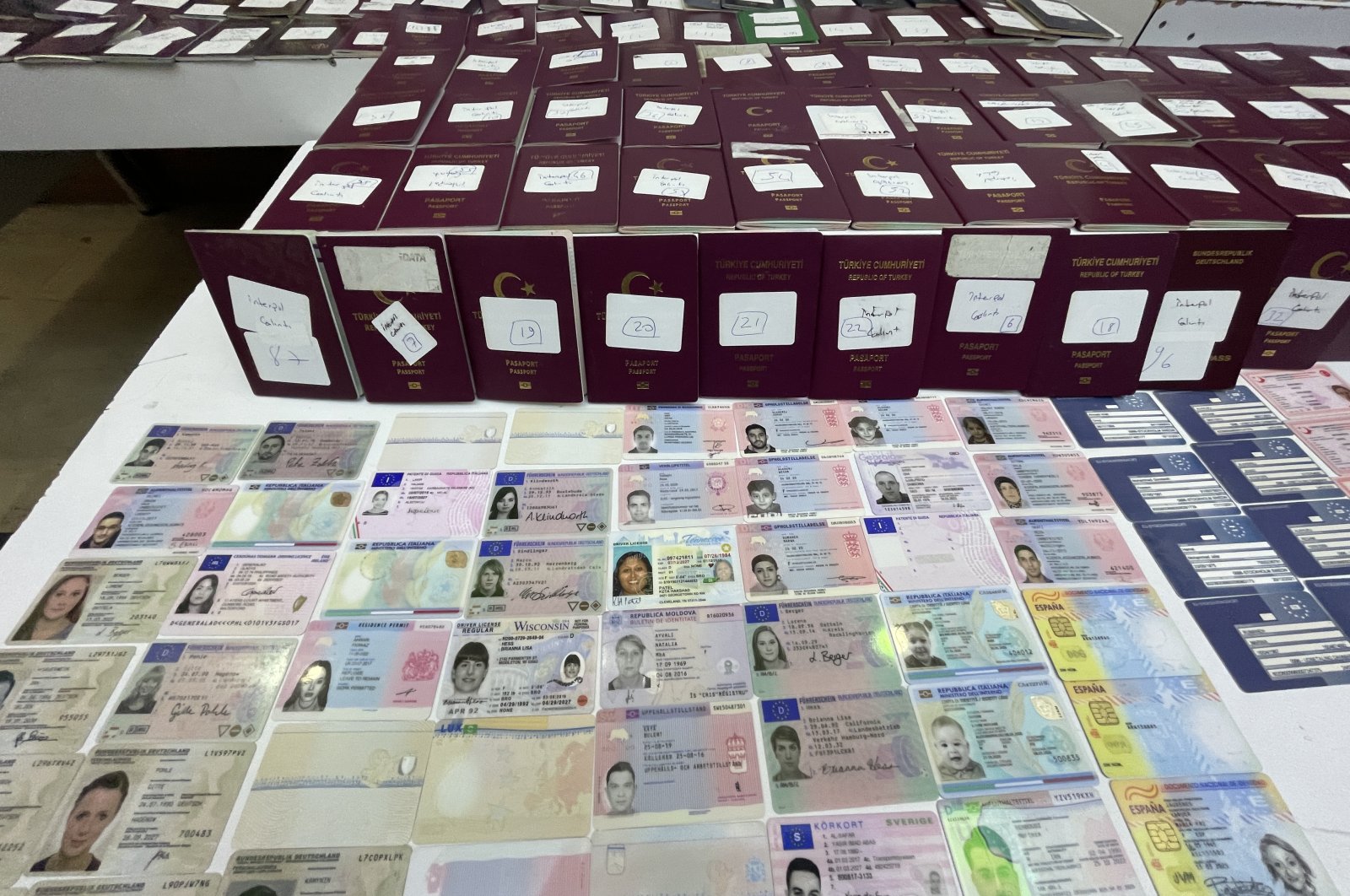 Passport and IDs recovered by police in Istanbul, Türkiye, Sept. 16, 2022. (AA Photo)