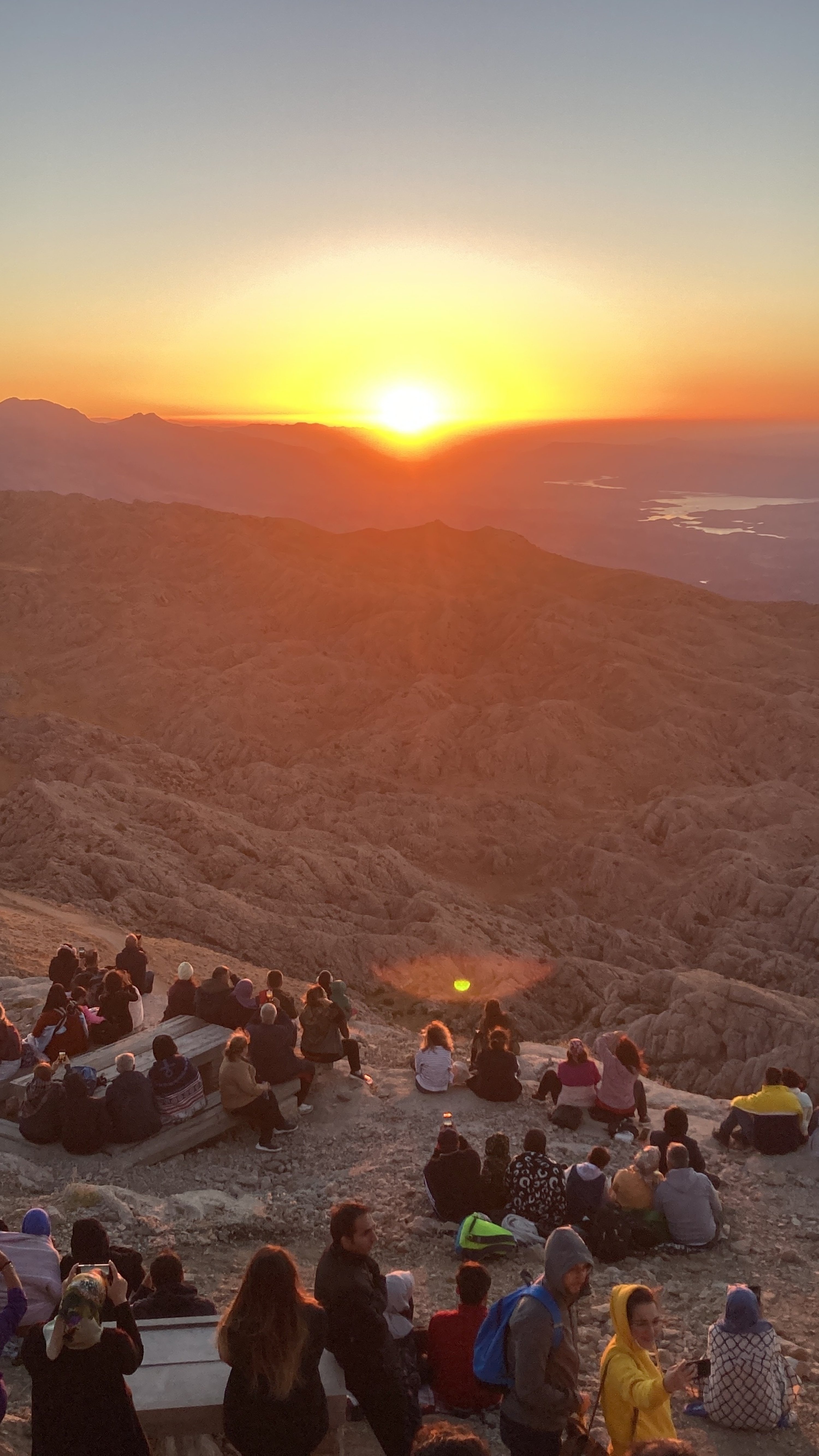 People gather to watch the sunrise on Türkiye's Mount Nemrut as part of the Commagene Biennial, Adıyaman province, Türkiye. (dpa Photo)