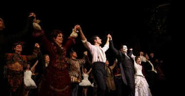Cast members stand on the stage after performing on the reopening night of "Phantom of the Opera" at the Majestic Theater in New York City, New York, U.S., Oct. 22, 2021. (REUTERS)